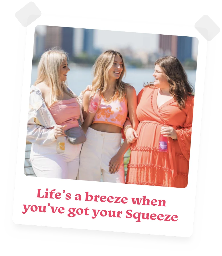 photo of three happy young women outdoors holding bottles of Bea's Squeeze lemonade with the caption Life's a breeze when you've got your Squeeze.