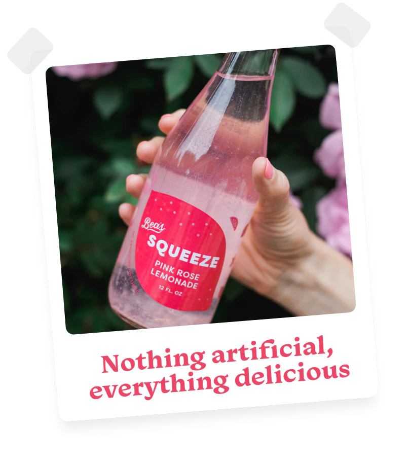 photo of a bottle of Bea's Squeeze pink rose lemonade with the caption Nothing artificial, everything delicious.